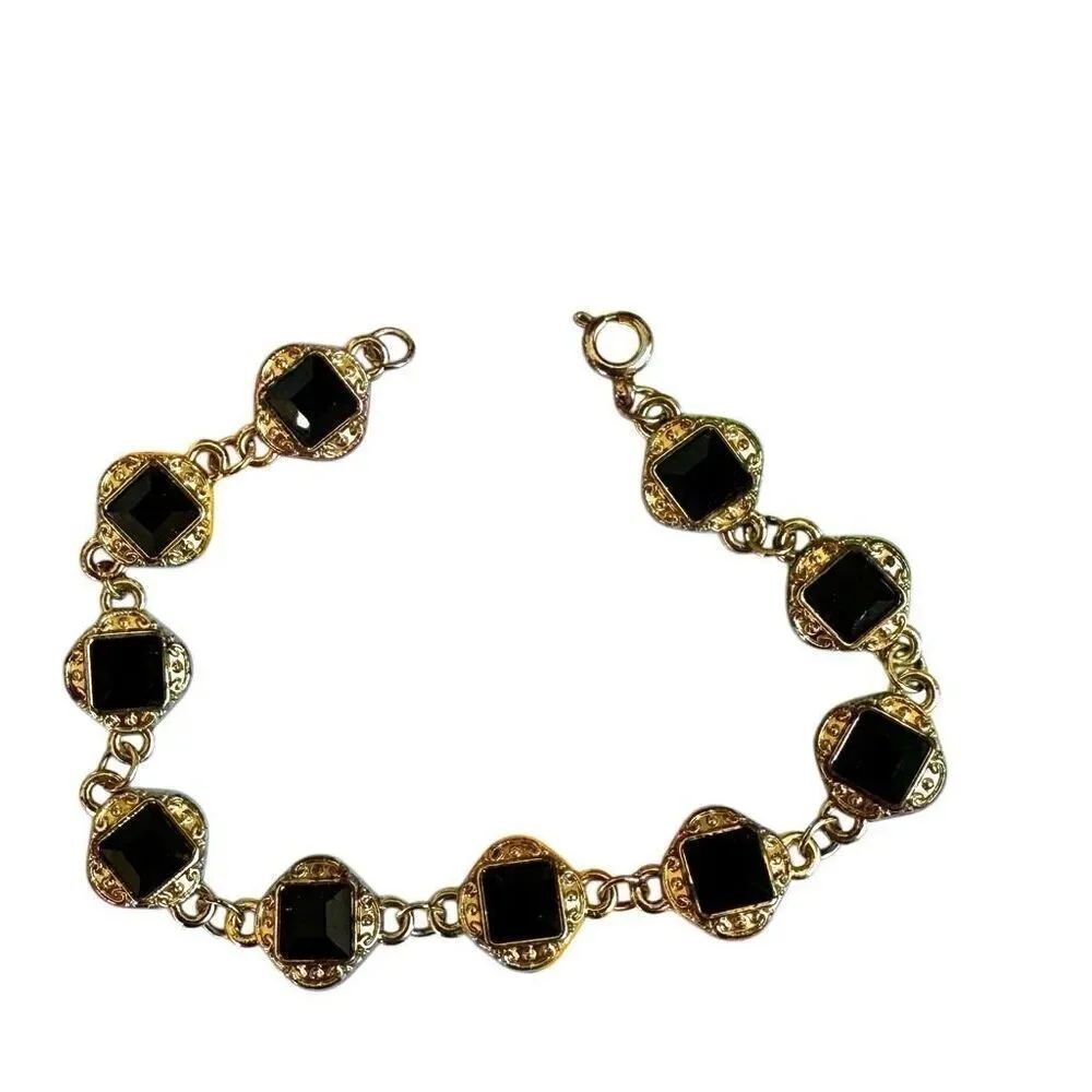Black and gold tone bracelet